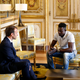 French President Emmanuel Macron meets with Mamoudou Gassama, 22, from Mali, at the presidential Elysee Palace in Paris on May, 28, 2018.